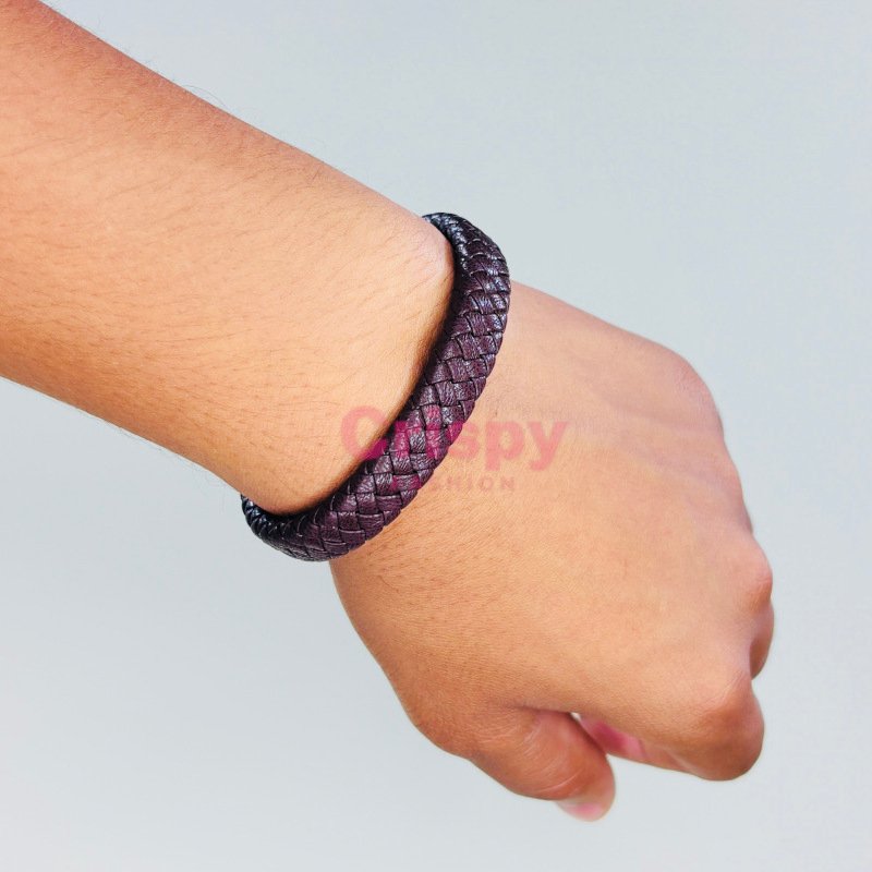 A two-tone black and brown braided bracelet with a sleek black magnetic clasp.