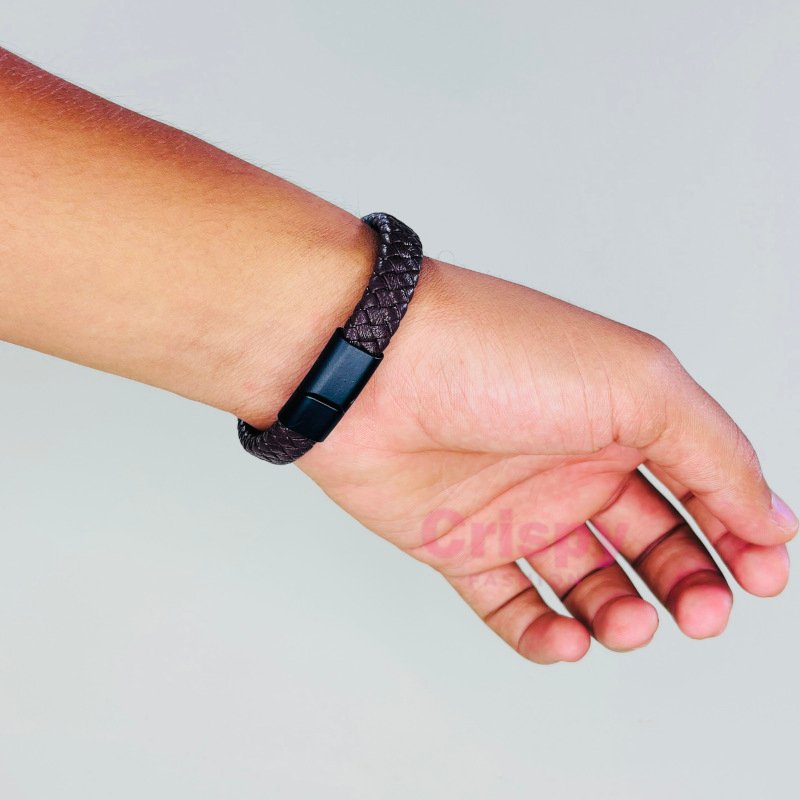 A two-tone black and brown braided bracelet with a sleek black magnetic clasp.
