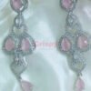 A pink and silver necklace set featuring American diamonds.