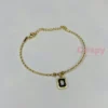 Golden Polished Chain Bracelet with Black Rectangular Charm For Women