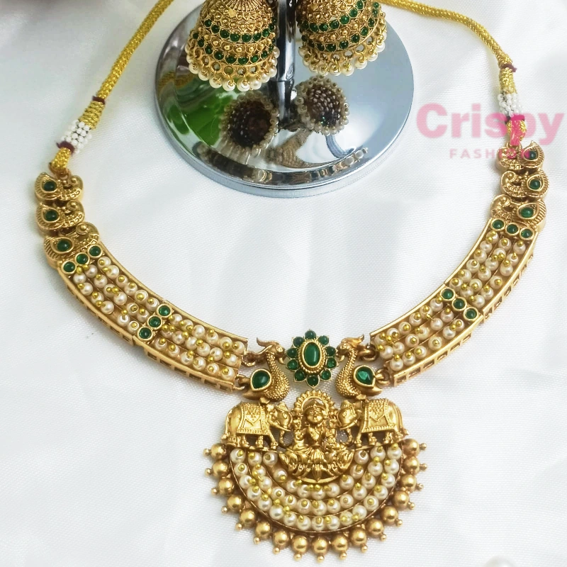 Traditional Golden Polished Goddess Lakshmi Temple Choker Necklace Set with Peacock Motifs and Jhumka Earrings