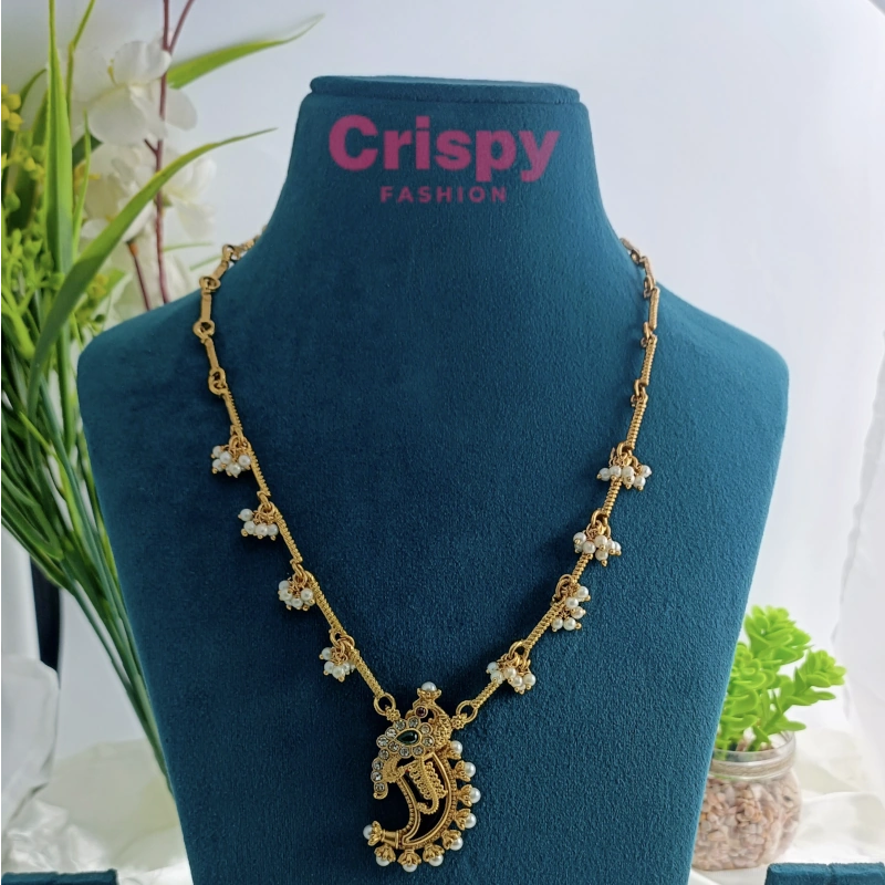 Traditional Golden Polished Paisley/Mango Motif Necklace Set with Jhumka Earrings