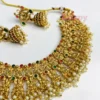 Traditional Heavy Golden Polished Choker Necklace Set with Lakshmi Motifs and Jhumka Earrings