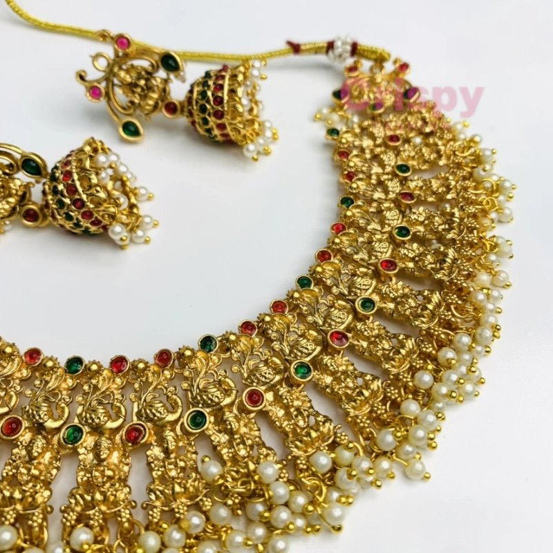 Traditional Heavy Golden Polished Choker Necklace Set with Lakshmi Motifs and Jhumka Earrings